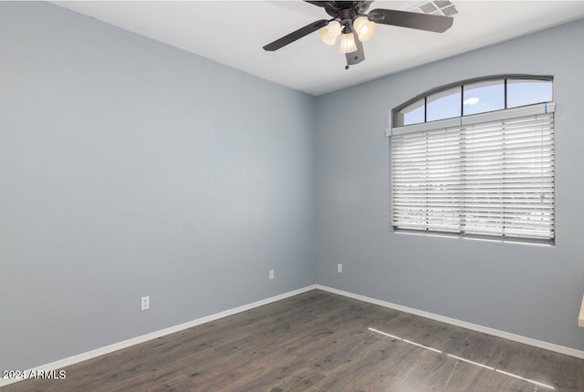 empty room featuring dark hardwood / wood-style floors and ceiling fan