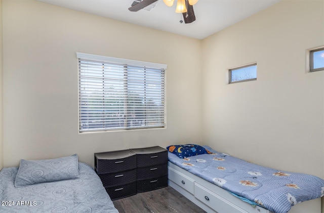 bedroom featuring ceiling fan and dark wood-type flooring