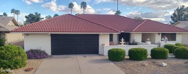 ranch-style home featuring a garage