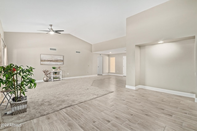 unfurnished living room featuring light wood-type flooring, ceiling fan, and lofted ceiling