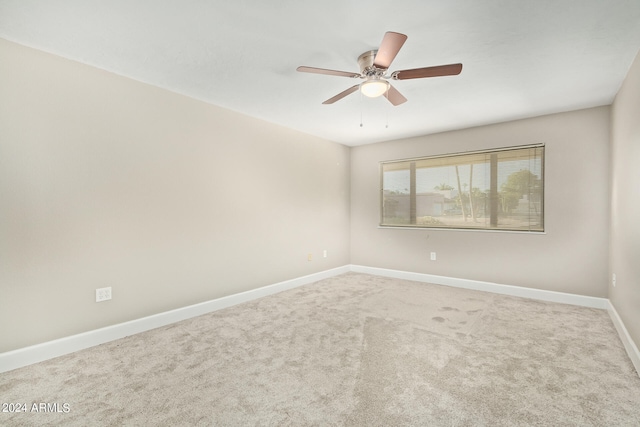 carpeted empty room with ceiling fan