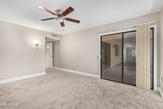 carpeted empty room with ceiling fan