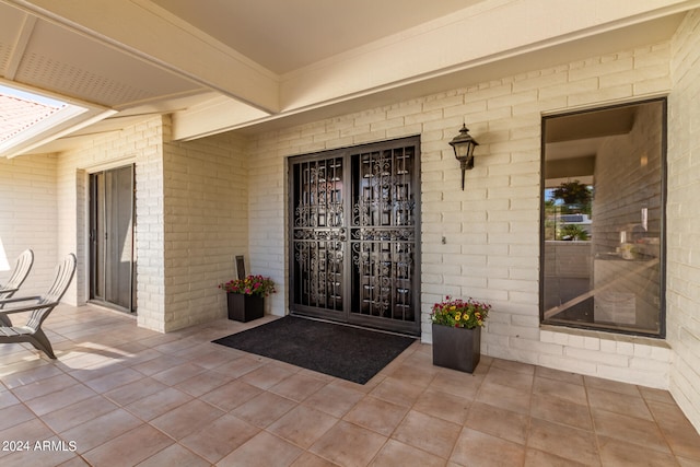 doorway to property featuring a patio area