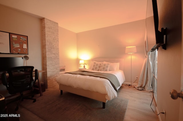 bedroom featuring light wood-type flooring