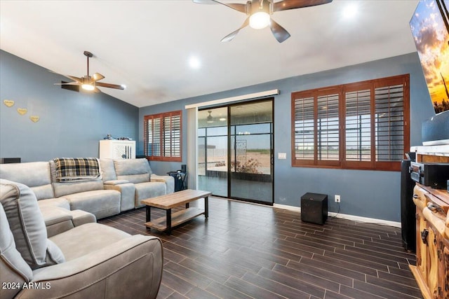 living room with dark hardwood / wood-style floors, vaulted ceiling, and ceiling fan