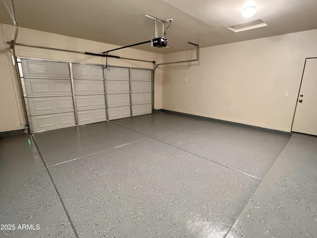 garage featuring baseboards and a garage door opener