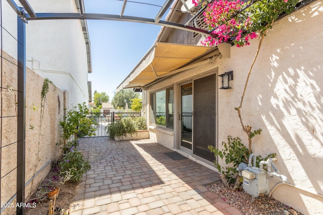 view of patio featuring fence