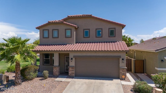 mediterranean / spanish-style home featuring a garage