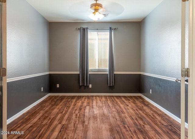 spare room featuring ceiling fan and hardwood / wood-style floors