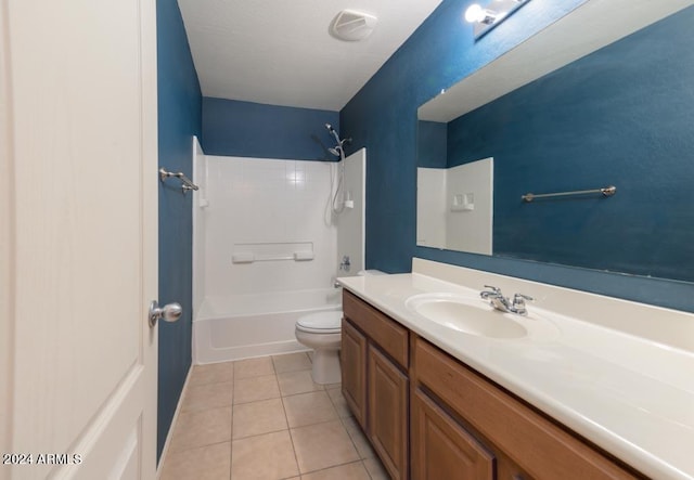 full bathroom featuring tile patterned floors, vanity, toilet, and shower / washtub combination