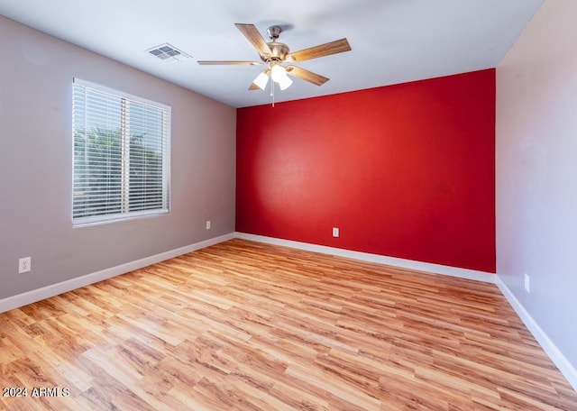 unfurnished room featuring ceiling fan and light wood-type flooring