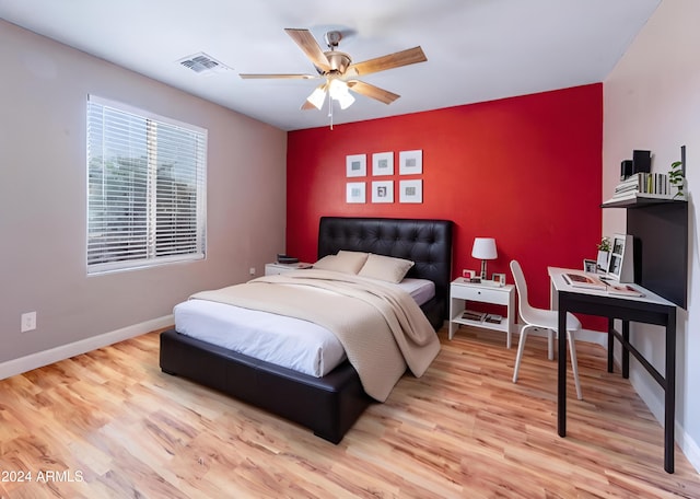 bedroom featuring light wood-type flooring and ceiling fan