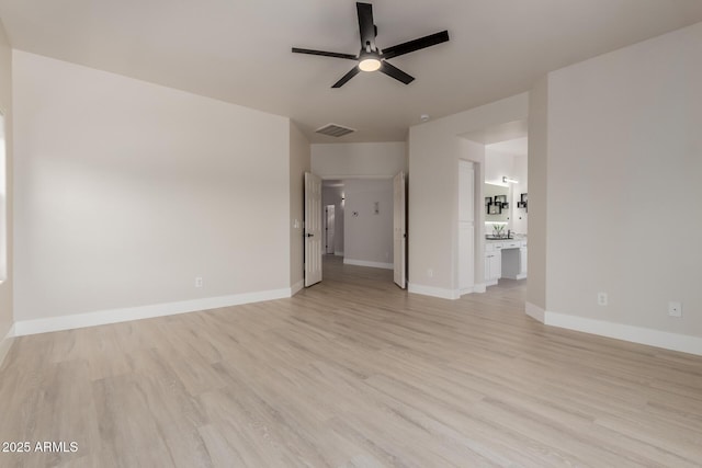 742 W Vineyard Plains Dr, San Tan Valley, AZ 85143 - unfurnished living room featuring ceiling fan and light wood-style flooring