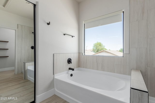 742 W Vineyard Plains Dr, San Tan Valley, AZ 85143 - bathroom featuring a bath and wood finished floors