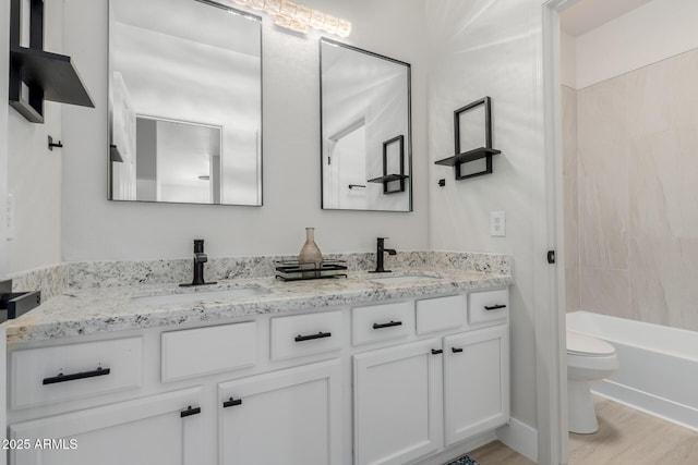 742 W Vineyard Plains Dr, San Tan Valley, AZ 85143 - bathroom with double vanity, wood finished floors, and tub / shower combination