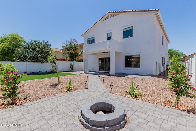742 W Vineyard Plains Dr, San Tan Valley, AZ 85143 - rear view of house with a patio area, an outdoor fire pit, a fenced backyard, and stucco siding