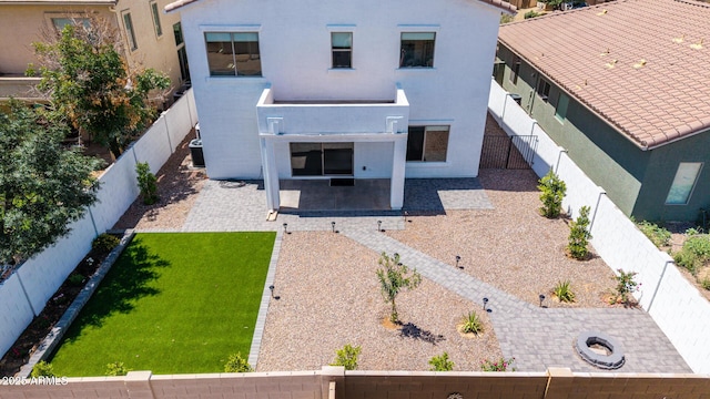742 W Vineyard Plains Dr, San Tan Valley, AZ 85143 - rear view of property featuring a patio area, stucco siding, and a fenced backyard