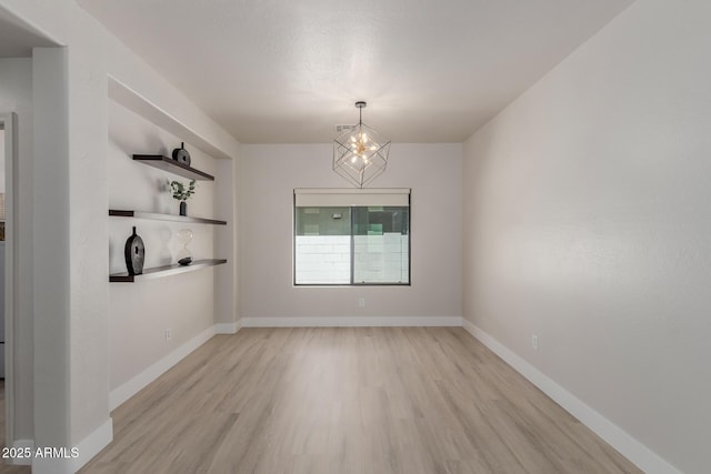 742 W Vineyard Plains Dr, San Tan Valley, AZ 85143 - unfurnished dining area with a chandelier and light wood-style floors