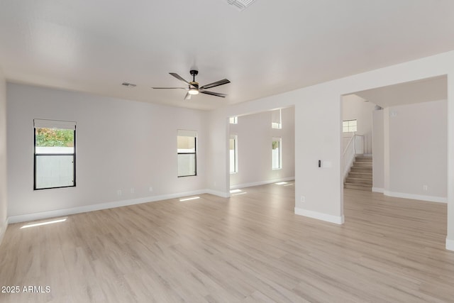 742 W Vineyard Plains Dr, San Tan Valley, AZ 85143 - unfurnished living room with light wood finished floors and ceiling fan