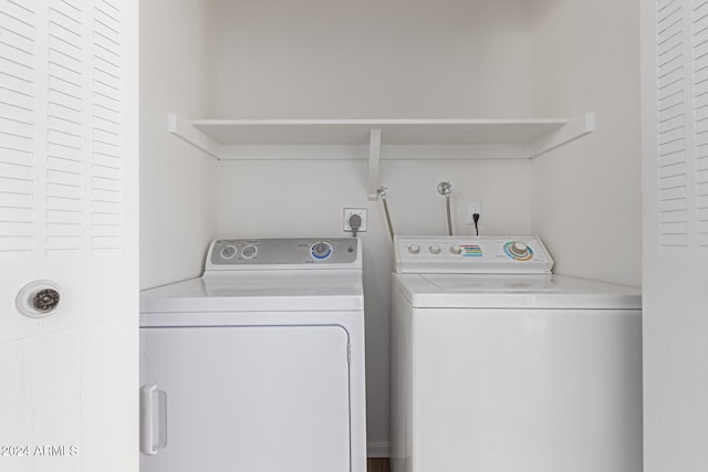 washroom with independent washer and dryer