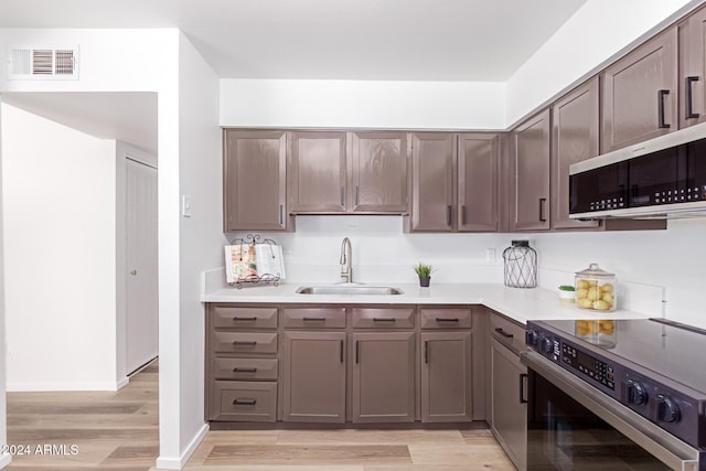 kitchen featuring light hardwood / wood-style floors, sink, and stainless steel appliances