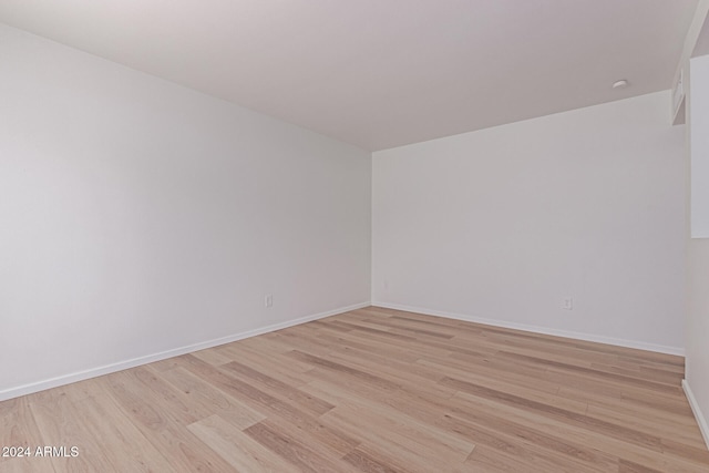 unfurnished room featuring light hardwood / wood-style flooring