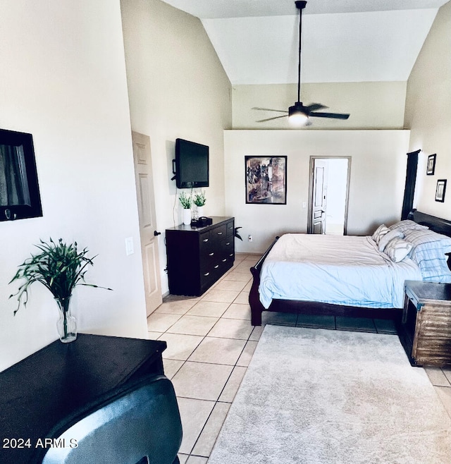 tiled bedroom featuring ceiling fan and high vaulted ceiling