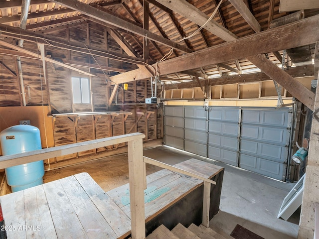 garage featuring wood walls