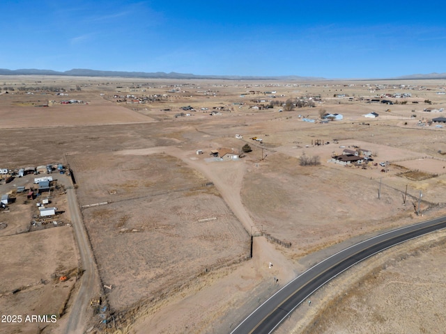 aerial view featuring view of desert, a rural view, and a mountain view