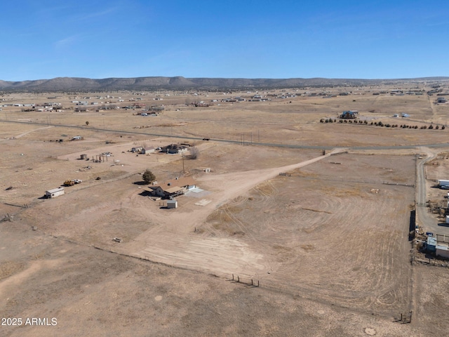 bird's eye view featuring a desert view, a rural view, and a mountain view