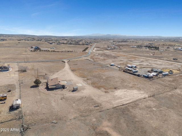 birds eye view of property with a rural view and a mountain view