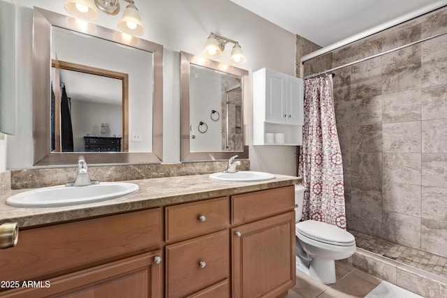 bathroom featuring tile patterned floors, vanity, curtained shower, and toilet