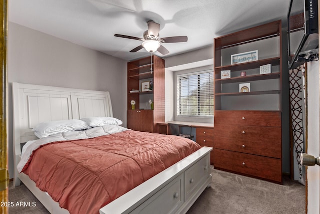 bedroom with ceiling fan and light carpet