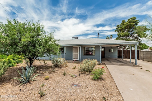 2019 W Stella Ln, Phoenix, AZ 85015 - ranch-style house with concrete driveway, a carport, and covered porch