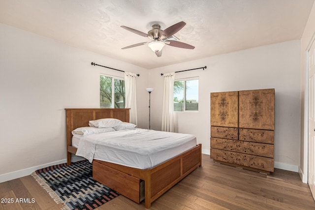 2019 W Stella Ln, Phoenix, AZ 85015 - bedroom with wood finished floors, baseboards, and a ceiling fan