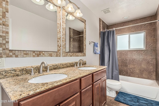 2019 W Stella Ln, Phoenix, AZ 85015 - full bathroom with shower / tub combo, toilet, and double vanity