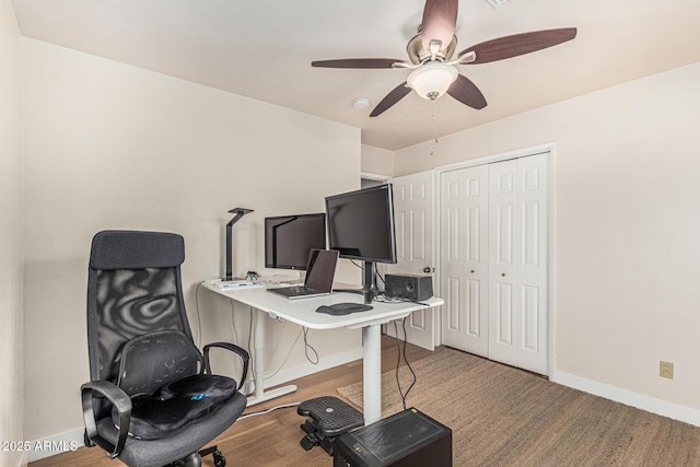 2019 W Stella Ln, Phoenix, AZ 85015 - office with baseboards, ceiling fan, and wood finished floors