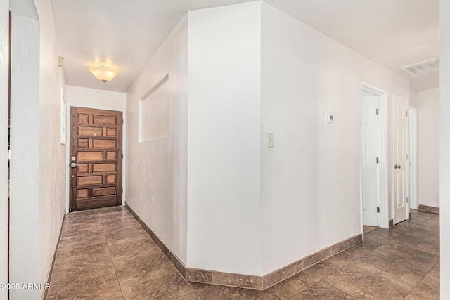 2019 W Stella Ln, Phoenix, AZ 85015 - hall with baseboards and stone finish flooring