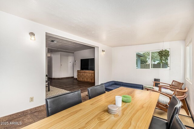 2019 W Stella Ln, Phoenix, AZ 85015 - dining space featuring baseboards