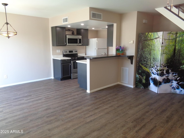 kitchen featuring visible vents, appliances with stainless steel finishes, and dark wood-style flooring