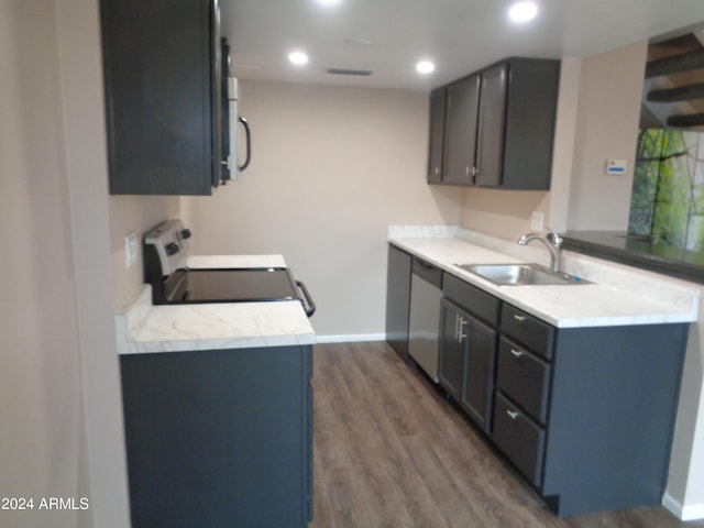 kitchen with range with electric cooktop, a sink, dark wood-style floors, white microwave, and dishwasher