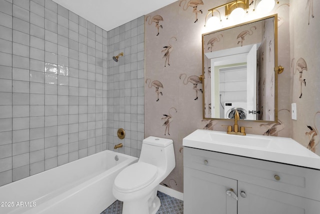 bathroom featuring vanity, toilet, and washtub / shower combination