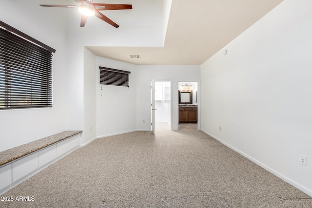 20801 N 90th Pl Unit 210, Scottsdale, AZ 85255 - unfurnished living room featuring a ceiling fan, baseboards, light colored carpet, and visible vents