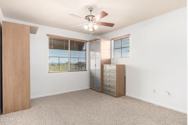 20801 N 90th Pl Unit 210, Scottsdale, AZ 85255 - unfurnished bedroom with baseboards, carpet, and ceiling fan