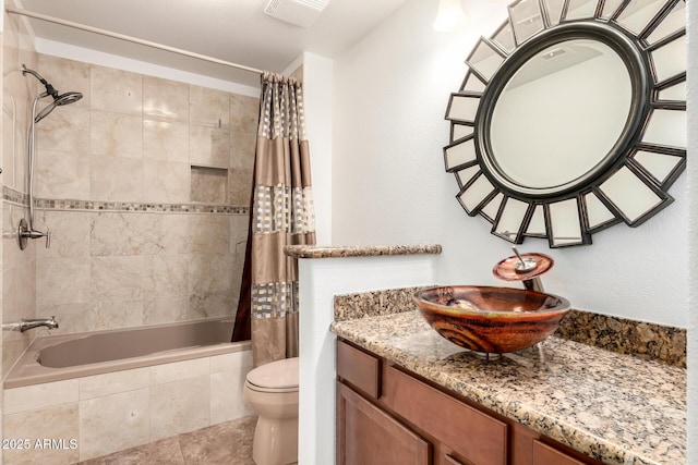 20801 N 90th Pl Unit 210, Scottsdale, AZ 85255 - bathroom with tiled shower / bath combo, toilet, tile patterned flooring, and vanity