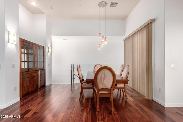 20801 N 90th Pl Unit 210, Scottsdale, AZ 85255 - dining room with baseboards, dark wood-style floors, and visible vents
