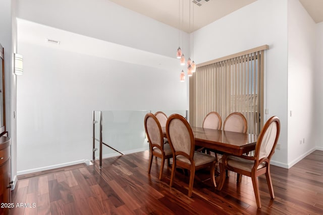 20801 N 90th Pl Unit 210, Scottsdale, AZ 85255 - dining room with baseboards, visible vents, and wood finished floors