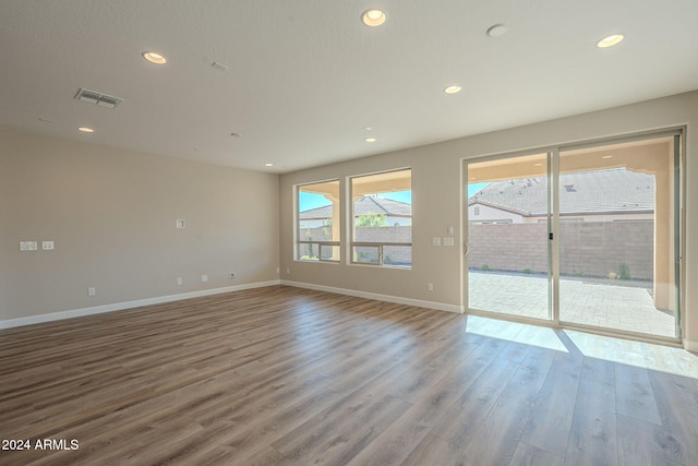 spare room featuring hardwood / wood-style flooring