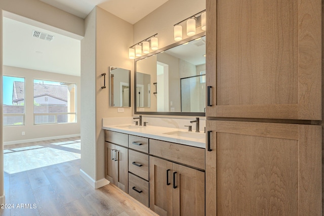 bathroom featuring hardwood / wood-style flooring and vanity