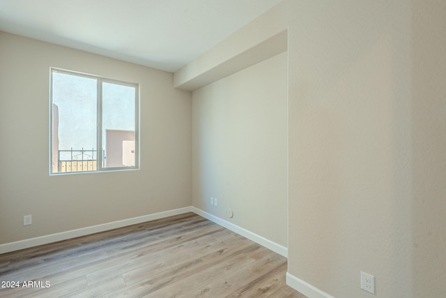 unfurnished room featuring light hardwood / wood-style floors